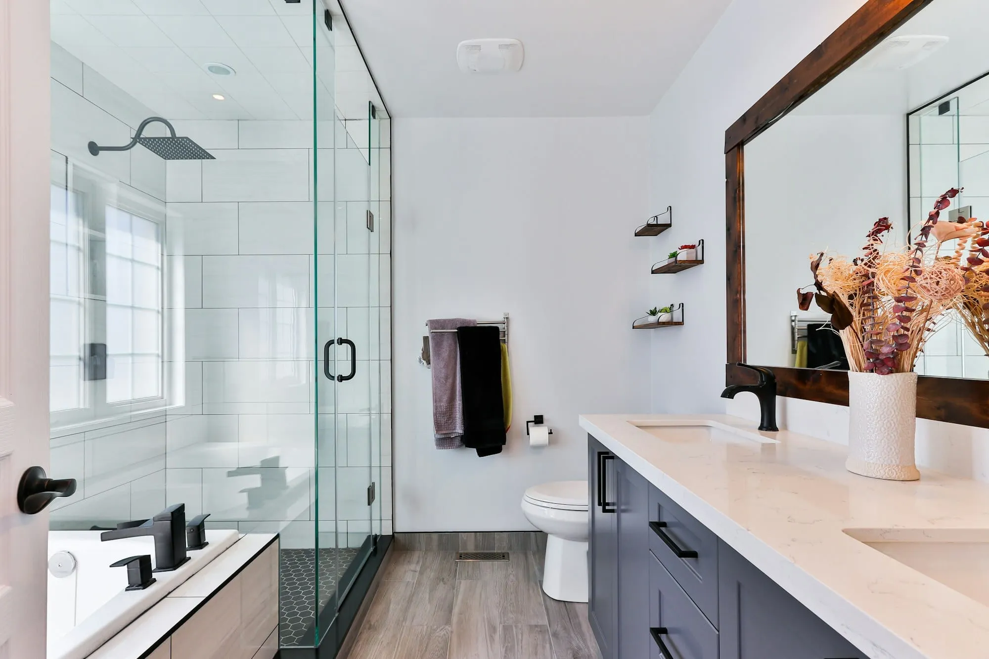 Bright modern bathroom with glass shower